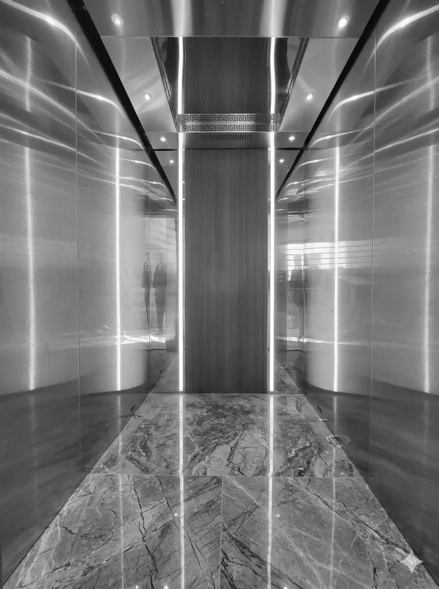 Handcrafted elevator doors and high-speed mechanics